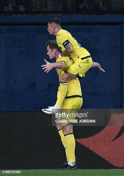 Villarreal's Norwegian forward Alexander Sorloth celebrates with Villarreal's Spanish forward Yeremi Pino after scoring during the UEFA Europa League...