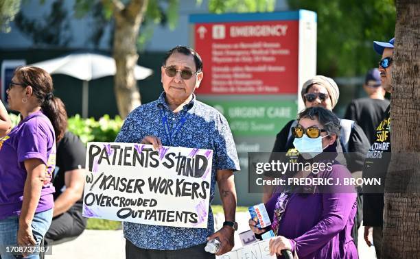 Patients join Kaiser Permanente health care employees, as well as Union members representing workers, as they walk the picket line in Los Angeles...