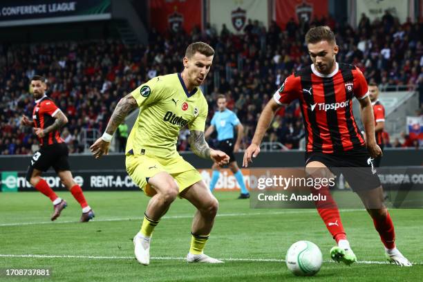 Serdar Aziz of Fenerbahce and Jan Bernat of Spartak Trnava compete during the UEFA Conference League Group H match between Spartak Trnava and...