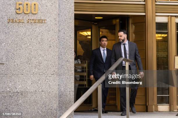 Matt Huang, co-founder and managing partner of Paradigm Operations LP, left, exits court in New York, US, on Thursday, Oct. 5, 2023. Former FTX...