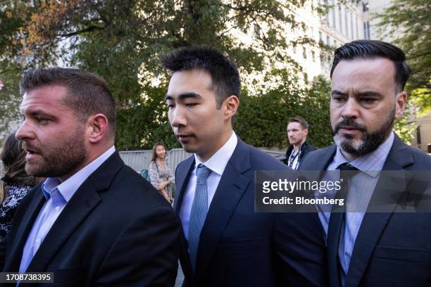 Matt Huang, co-founder and managing partner of Paradigm Operations LP, center, exits court in New York, US, on Thursday, Oct. 5, 2023. Former FTX...