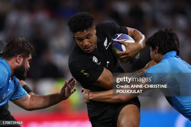 New Zealand's left wing Leicester Fainga'anuku attempts to break away during the France 2023 Rugby World Cup Pool A match between New Zealand and...