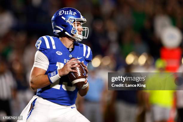 Riley Leonard of the Duke Blue Devils drops back to pass against the Notre Dame Fighting Irish at Wallace Wade Stadium on September 30, 2023 in...