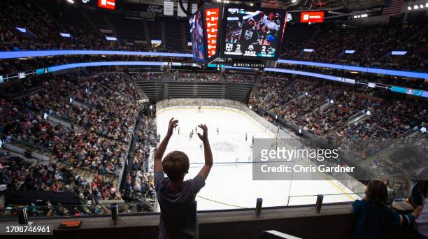 Young fan celebrates a goal by the Los Angeles Kings during their pre-season game against the San Jose Sharks at the Delta Center October 5, 2023 in...