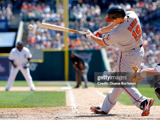 Chris Davis of the Baltimore Orioles hits a ground-rule double against the Detroit Tigers that drove in Manny Machado in the seventh inning at...