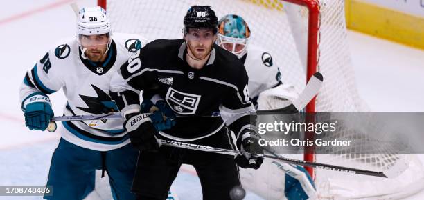 Mario Ferraro of the San Jose Sharks holds Pierre-Luc Dubois of the Los Angeles Kings during the third period of their pre-season game at the Delta...