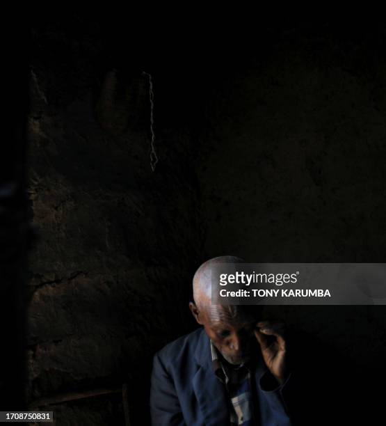 Francois AUSSEILL Eighty-nine year old Ibrahim, sits inside his hut as he speaks about the drought that has hit this region and has kept them from...