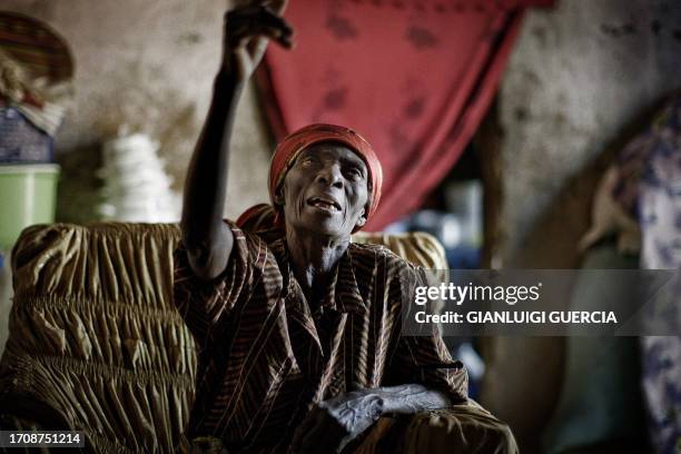 Mama Rosa, an 80-year old Angolan woman, gestures as she talks about the civil war between Union for the Total Independence of Angola and Popular...