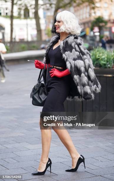 Charlotte Hawkins dressed as Cruella de Vil arrives at Global's studios in Leicester Square, London. Picture date: Friday October 6, 2023.