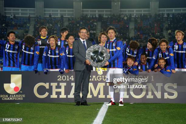 Captain Yasuhito Endo of Gamba Osaka is presented the J.League Champions plaque from J.League Chairman Mitsuru Murai at the award ceremony as the...