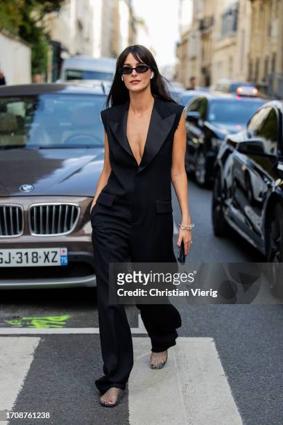 Leia Sfez wears black overall outside Victoria Beckham during the Womenswear Spring/Summer 2024 as part of Paris Fashion Week on September 29, 2023...