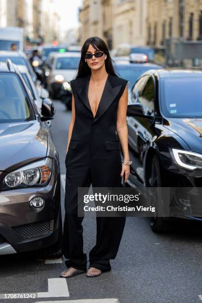 Leia Sfez wears black overall outside Victoria Beckham during the Womenswear Spring/Summer 2024 as part of Paris Fashion Week on September 29, 2023...