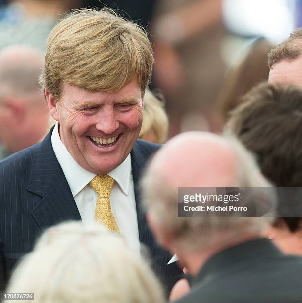 King Willem-Alexander of The Netherlands meets with people during an official visit to the town centre on June 19, 2013 in Goor, Netherlands.