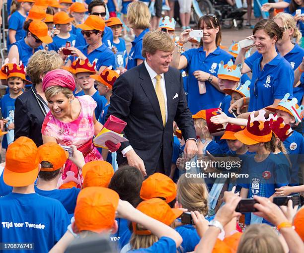 King Willem-Alexander of The Netherlands and Queen Maxima of The Netherlands make an official visit to the town centre on June 19, 2013 in Goor,...