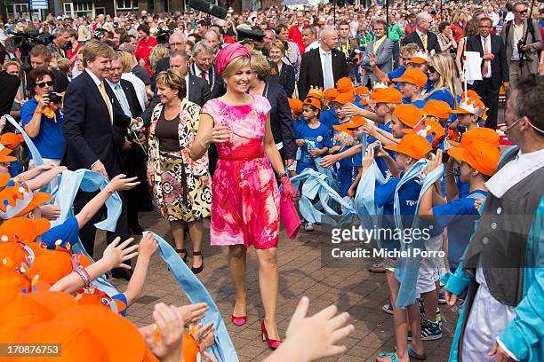 King Willem-Alexander of The Netherlands and Queen Maxima of The Netherlands make an official visit to the town centre on June 19, 2013 in Goor,...