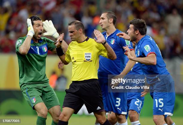 Gianluigi Buffon Giorgio Chiellini and Andrea Barzagli Italy protest to Referee Diego Abal after Japan were awarded a penalty during the FIFA...