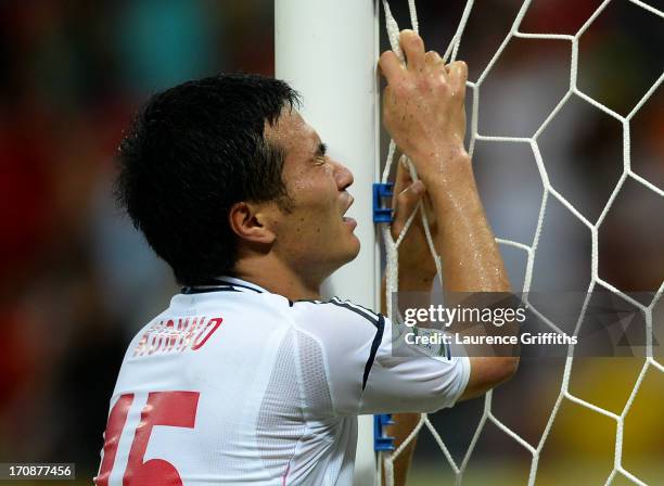 Yasuyuki Konno of Japan reacts after his team conceded a fourth goal during the FIFA Confederations Cup Brazil 2013 Group A match between Italy and...