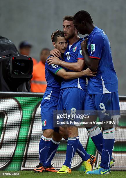 Sebastian Giovinco of Italy celebrates with team-mates Mario Balotelli and Claudio Marchisio during the FIFA Confederations Cup Brazil 2013 Group A...