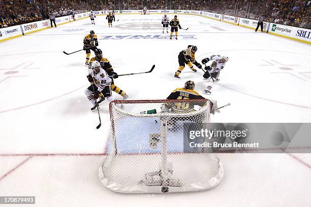 Michal Handzus of the Chicago Blackhawks scores a goal in the first period against Tuukka Rask of the Boston Bruins in Game Four of the 2013 NHL...