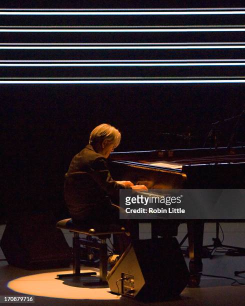 Ryuichi Sakamoto performs on stage at the Royal Festival Hall on June 19, 2013 in London, England.