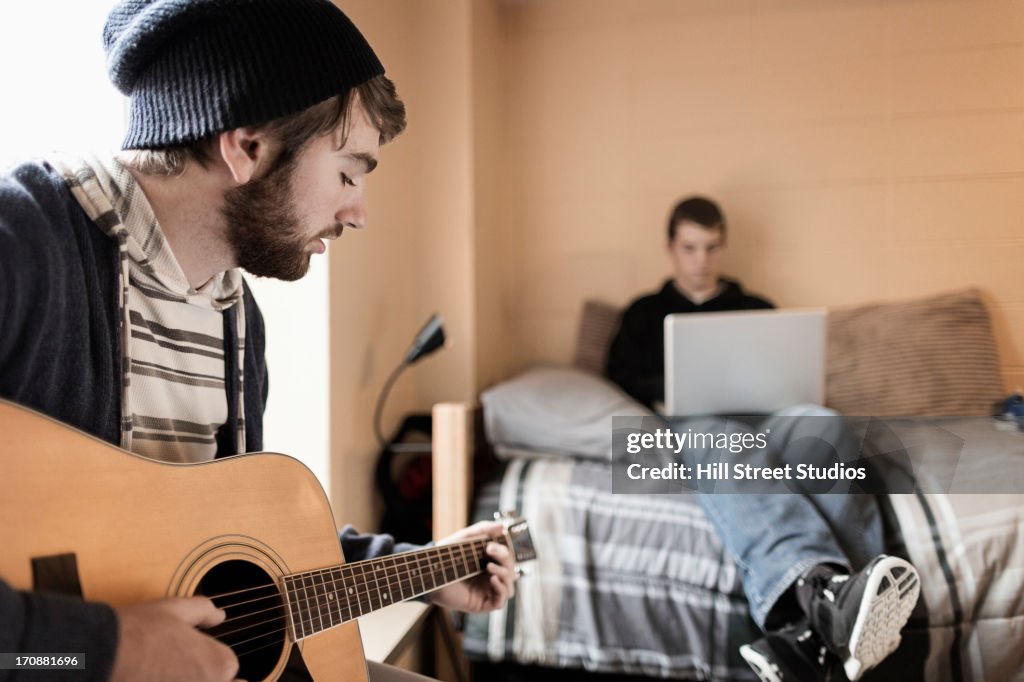 Students relaxing in dorm room