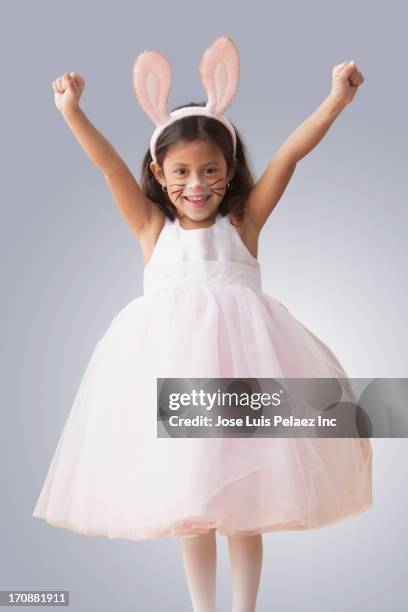 hispanic girl wearing bunny ears and whiskers - tierkostüm stock-fotos und bilder
