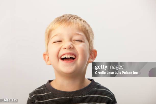 caucasian boy laughing - kid eyes closed stock pictures, royalty-free photos & images