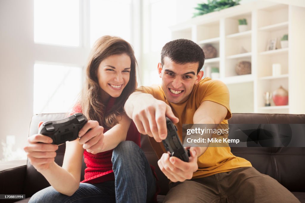 Couple playing video games together