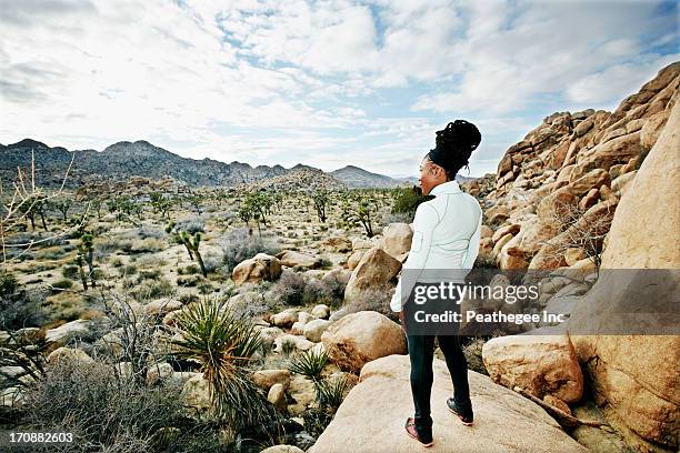 black runner in desert landscape, joshua tree national park, california, united states - travel destinations running stock pictures, royalty-free photos & images