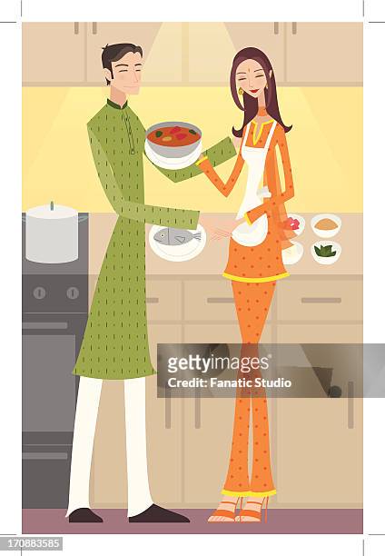 couple preparing food in a kitchen - indian curry stock illustrations