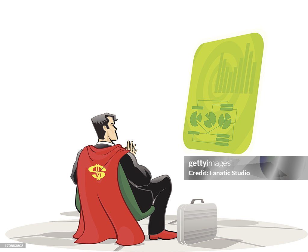 Super hero examining a virtual screen
