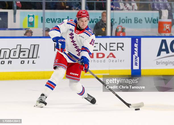 Luke Ellinas of the Kitchener Rangers shoots the puck in the second period against the Saginaw Spirit at Kitchener Memorial Auditorium on September...
