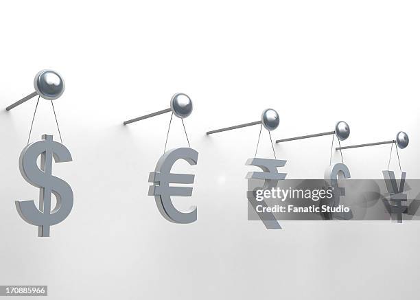 international currencies hanging on nail over white background - wall e stock illustrations