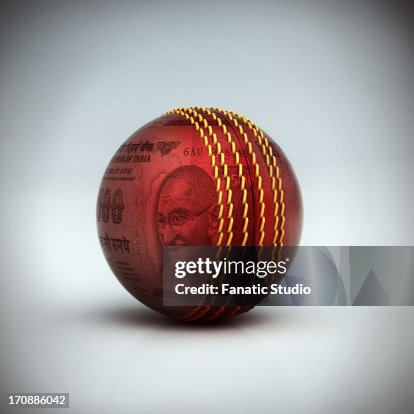 A cricket ball with Indian currency A cricket ball with Indian currency