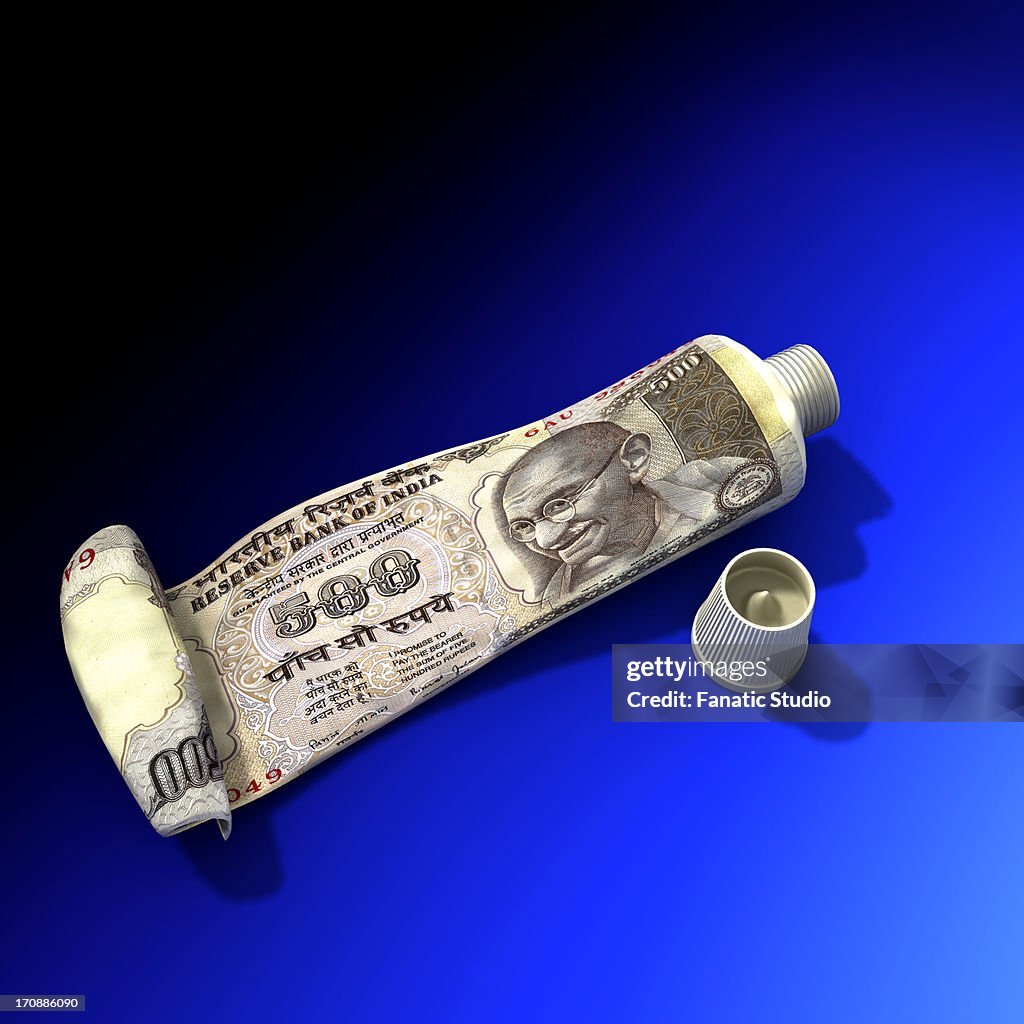 Indian five hundred Rupee note on toothpaste
