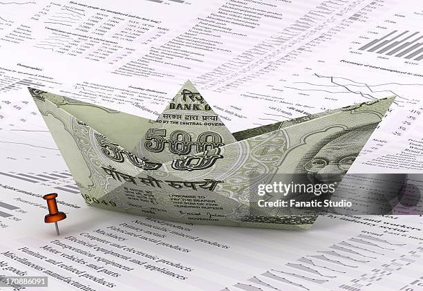 sailing boat made of indian currency note on stock listing paper - gandhi quotes stock illustrations