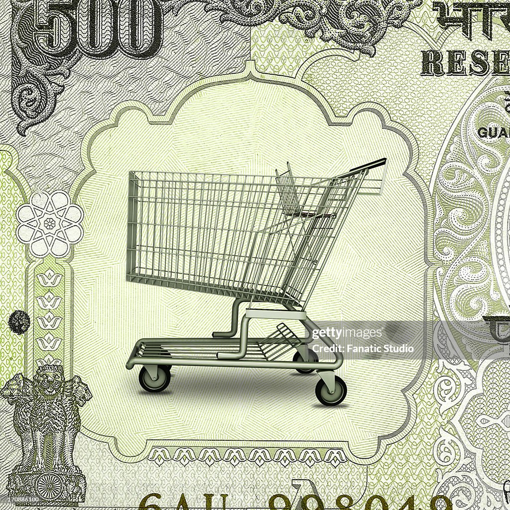 Shopping cart on Indian currency note