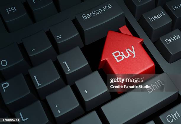 illustrative image of keyboard with house button representing online property deal - online advertising stock illustrations