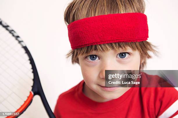 boy ready for tennis - headband stock-fotos und bilder