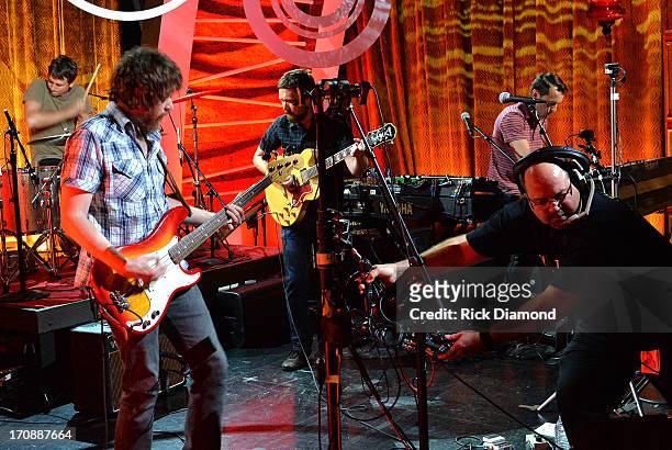 Rollum Haas, Roger Dabbs, Matthew Pelham, and Mark Bond of The Features perform during the MTV, VH1, CMT & LOGO 2013 O Music Awards at the CMT office...