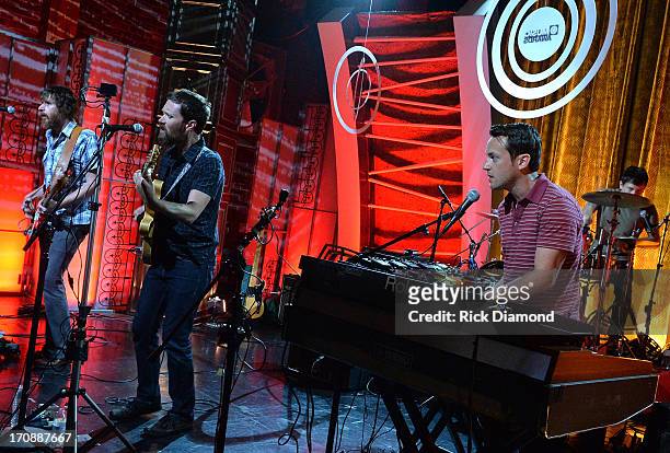 Roger Dabbs, Matthew Pelham, Mark Bond, and Rollum Haas of The Features perform during the MTV, VH1, CMT & LOGO 2013 O Music Awards at the CMT office...