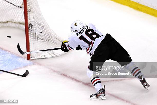 Marcus Kruger of the Chicago Blackhawks scores a goal in the second period against the Boston Bruins in Game Four of the 2013 NHL Stanley Cup Final...