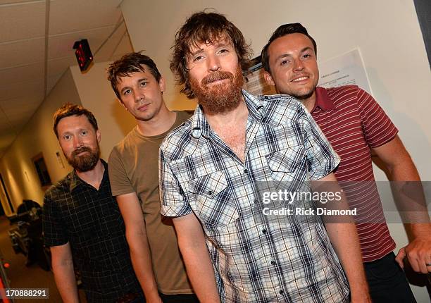 Matthew Pelham, Rollum Haas, Roger Dabbs, and Mark Bond of The Features pose backstage during the MTV, VH1, CMT & LOGO 2013 O Music Awards at the CMT...