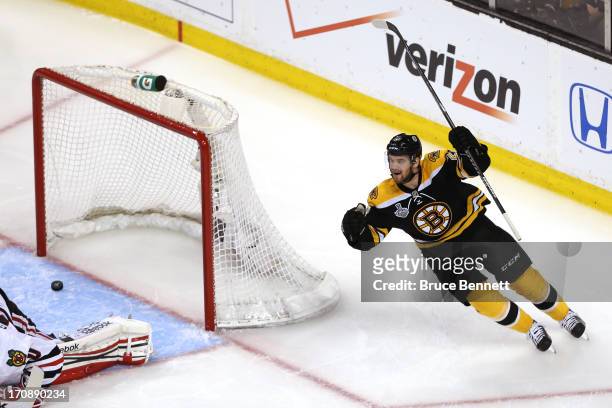 Daniel Paille of the Boston Bruins celebrates a goal in the third period by Patrice Bergeron against the Chicago Blackhawks in Game Four of the 2013...
