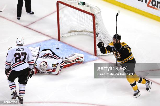 Daniel Paille of the Boston Bruins celebrates a goal in the third period by Patrice Bergeron against Corey Crawford Chicago Blackhawks in Game Four...