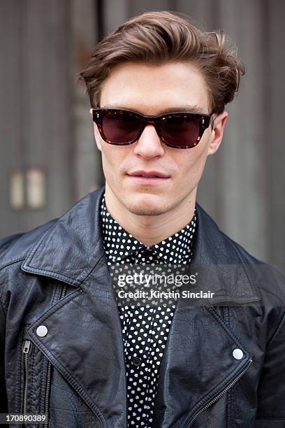 Model Oliver Cheshire wears Yves Saint Laurent jacket, and Reiss top on day 3 of London Collections: Men on June 18, 2013 in London, England.