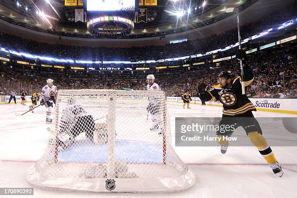 Daniel Paille of the Boston Bruins celebrates a goal in the third period by Patrice Bergeron against Corey Crawford of the Chicago Blackhawks in Game...