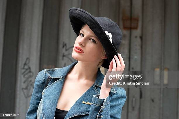 Model Chloe Jasmine wears a Mary Quant Hat, Karen Millen dress, See by Chloe Coat on day 2 of London Collections: Men on June 17, 2013 in London,...