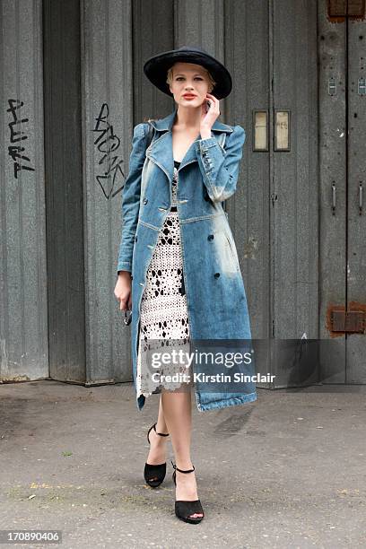 Model Chloe Jasmine wears a Mary Quant Hat, Karen Millen dress, See by Chloe Coat, Vintage Chanel bag, Zara shoes and Chloe sunglasses on day 2 of...
