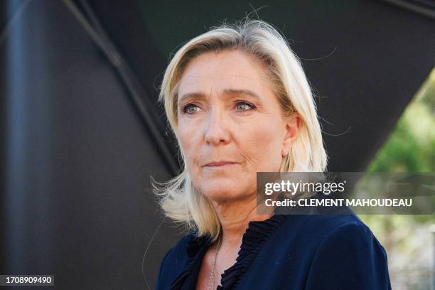 France's far-right party Rassemblement National parliament group president Marine Le Pen gives a press conference after visiting a day care facility...